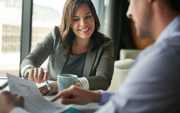 business people reviewing document